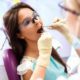 A woman receives a dental exam.